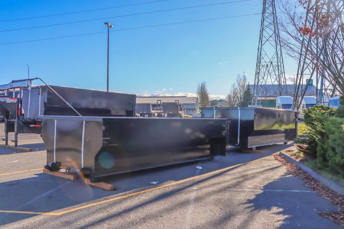Roll-off dumpster ready for waste disposal at job site for Demolition Dumpster Rental in Mabank